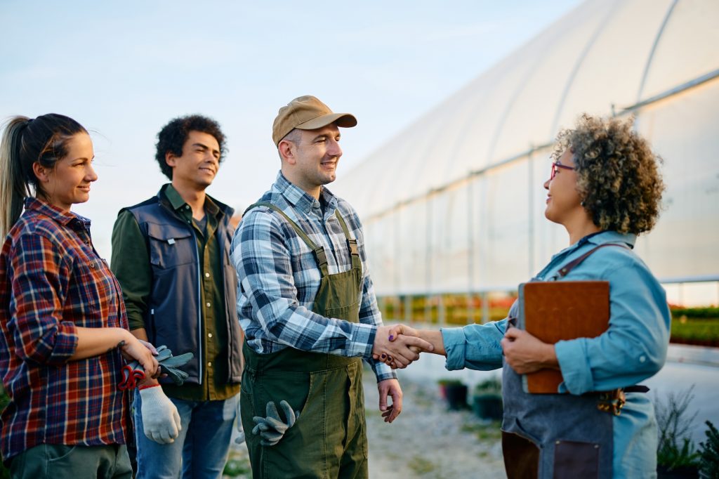 The group of happy-workers greeting USDA & BI controller