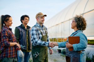 The group of happy-workers greeting USDA & BI controller
